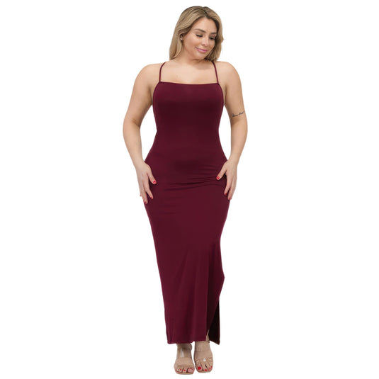 Elegant burgundy plus size maxi dress featuring crisscross back and thigh-high split, modeled with grace, highlighting curvy fashion.