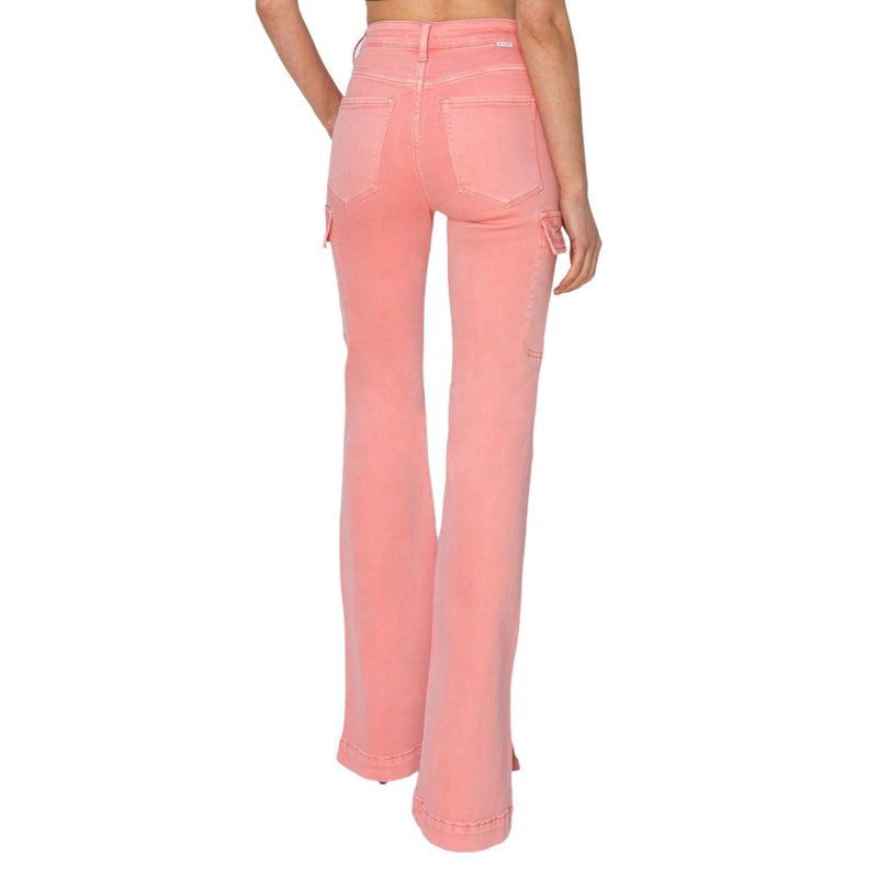 Load image into Gallery viewer, Rear view of a woman wearing pink high-rise bootcut cargo jeans with side slits.
