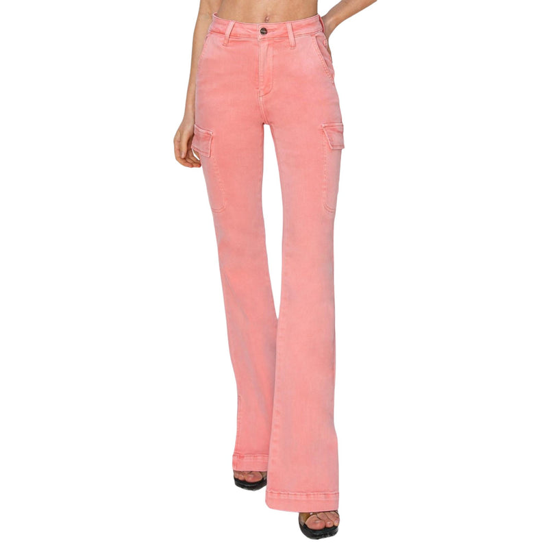 Load image into Gallery viewer, Front view of pink high-rise bootcut cargo jeans, showcasing the side slit detail, paired with black heels.
