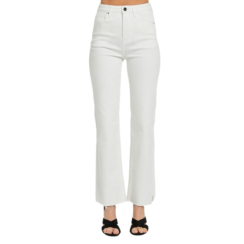 Load image into Gallery viewer, Close-up front view of high-rise white straight-leg jeans with a raw hem and tummy control feature, paired with black heeled sandals.
