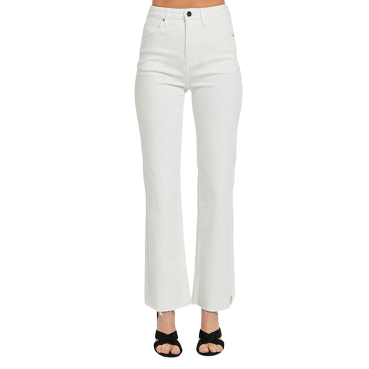 Close-up front view of high-rise white straight-leg jeans with a raw hem and tummy control feature, paired with black heeled sandals.