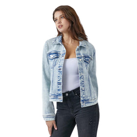 Woman in a washed denim jacket layered over a white tank top, looking casual yet chic, perfect for everyday wear.