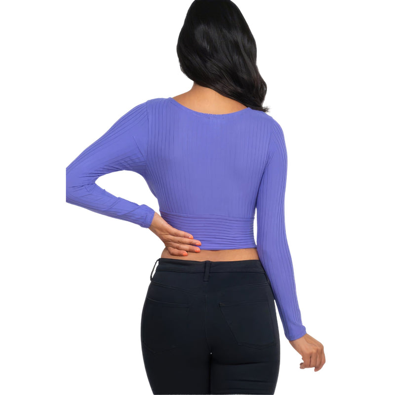 Load image into Gallery viewer, Rear view of a woman in a Periwinkle Ribbed Wrap Front Long Sleeve Top, emphasizing the top&#39;s fitted waist and ribbed texture.
