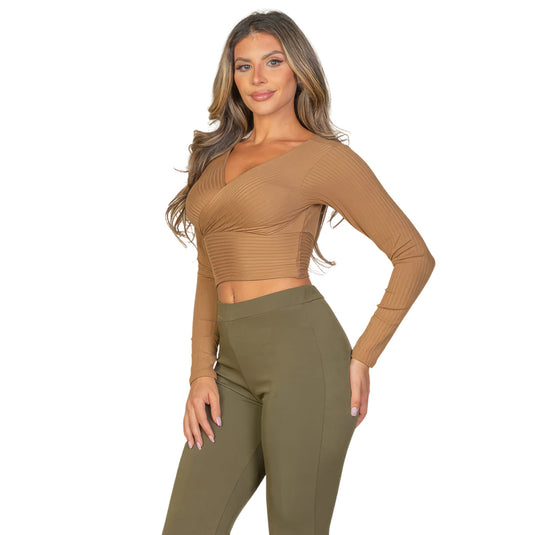 Chic woman posing in an olive ribbed wrap front long sleeve top and matching trousers, showcasing a monochromatic outfit.