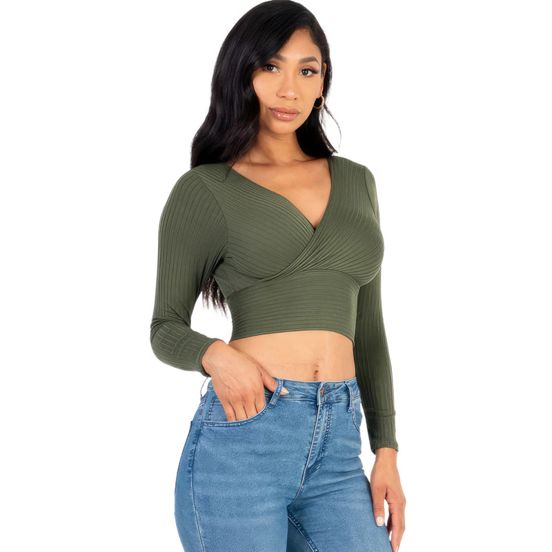 Load image into Gallery viewer, Elegant woman wearing a green ribbed wrap front long sleeve top, paired with light blue jeans for a casual yet sophisticated look.
