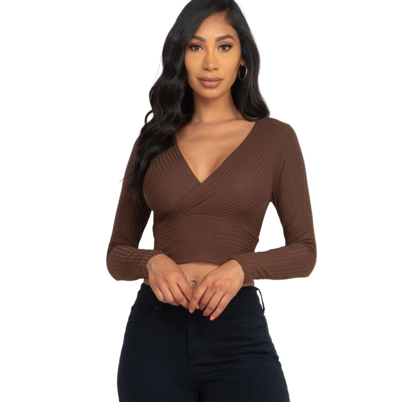 Load image into Gallery viewer, Stylish woman showcasing a Mocha Ribbed Wrap Front Long Sleeve Top with a deep V-neck, perfect for fall fashion trends.
