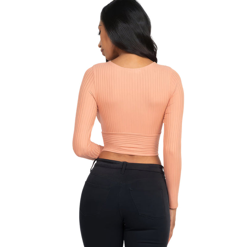 Load image into Gallery viewer, Back perspective of a Peach Ribbed Wrap Front Long Sleeve Top, focusing on the comfortable fit and ribbed design, perfect for versatile styling.
