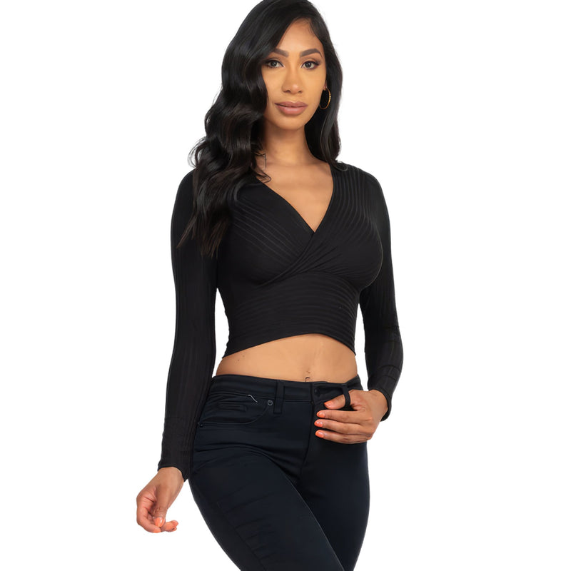 Load image into Gallery viewer, Close-up of a woman wearing a Black Ribbed Wrap Front Top highlighting the ribbed texture and stylish wrap design.
