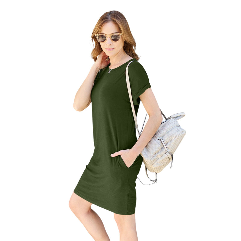 Load image into Gallery viewer, Blonde woman smiling and looking over her shoulder, wearing a green casual dress with short sleeves, accessorized with sunglasses and a brown crossbody bag, ideal for a relaxed summer outing
