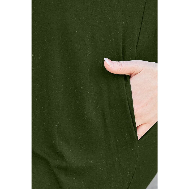 Load image into Gallery viewer, Close-up of a woman&#39;s hand resting in the pocket of a green casual dress made from bamboo and spandex blend, highlighting the practical and comfortable design
