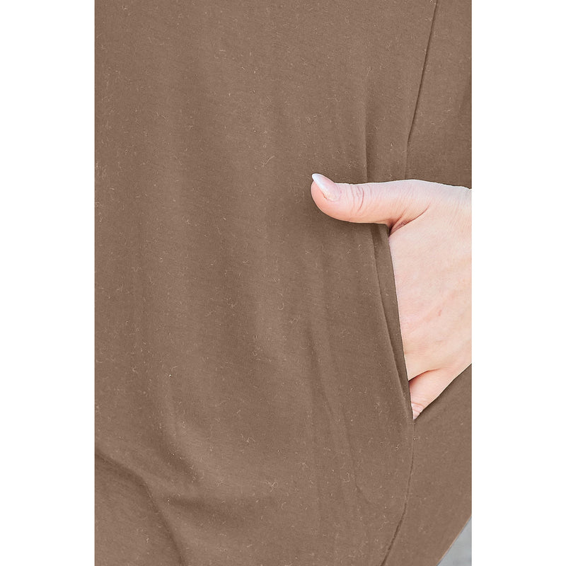 Load image into Gallery viewer, Close-up of a woman&#39;s hand resting in the pocket of a light brown casual dress made from bamboo and spandex blend, highlighting the practical and comfortable design.
