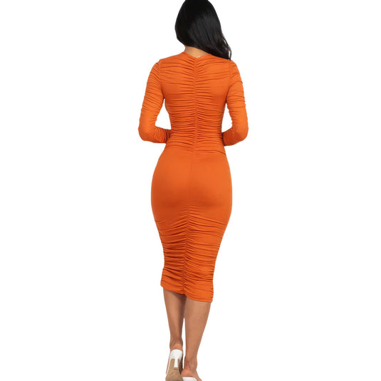 Back perspective of a vibrant mango ruched midi dress, accentuating the contoured fit and elegant mid-length cut.