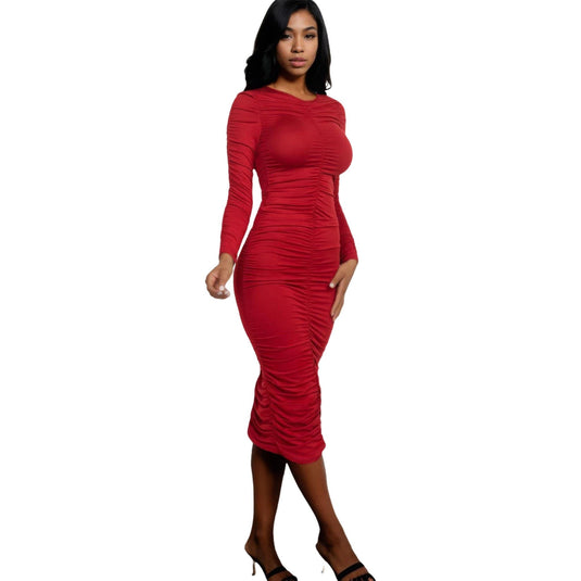 Stunning model wearing a ruched long sleeve midi dress in rich winery red, complemented by black stiletto heels.