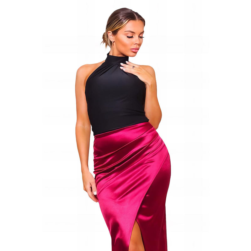 Load image into Gallery viewer, Elegant woman in a black sleeveless turtleneck top and fuchsia satin midi skirt with a sophisticated crossover front, ideal for formal occasions.
