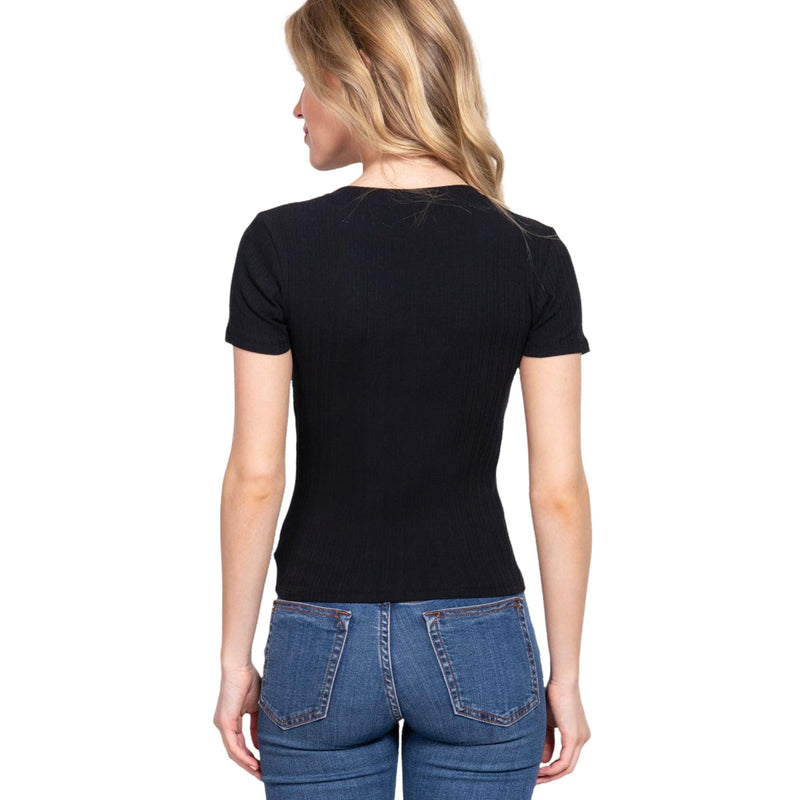 Load image into Gallery viewer, A rear view of a woman wearing a timeless black short-sleeve rib knit top. Paired with denim jeans, the top provides a seamless and chic look suitable for various occasions.
