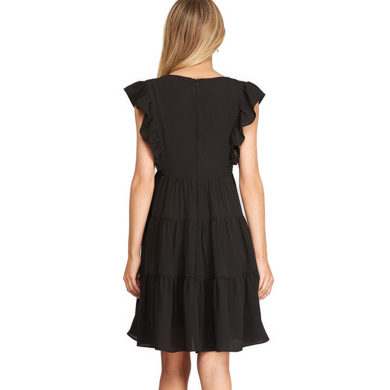 Load image into Gallery viewer, A sophisticated back view of a sleeveless black summer dress with tiered ruffles, a staple for any elegant evening.
