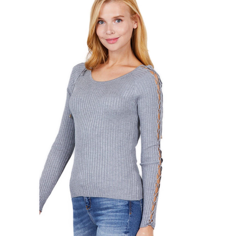 Load image into Gallery viewer, Close-up on the strappy shoulder detail of a heather grey ribbed sweater worn by a woman, showcasing the intricate weave.
