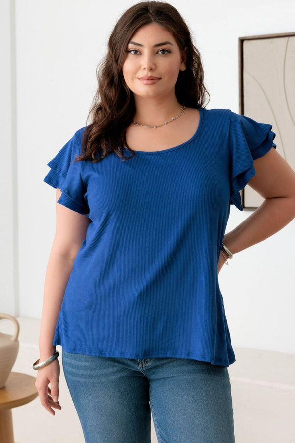  Straight-on view of a woman wearing a plus-size royal blue short fluttery sleeve top, styled with jeans, showcasing the fit and ribbed texture of the top.