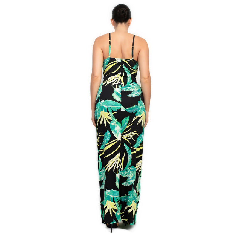 Load image into Gallery viewer, Back view of a black bodycon maxi dress with a tropical print, emphasizing the slim fit and summer vibe.
