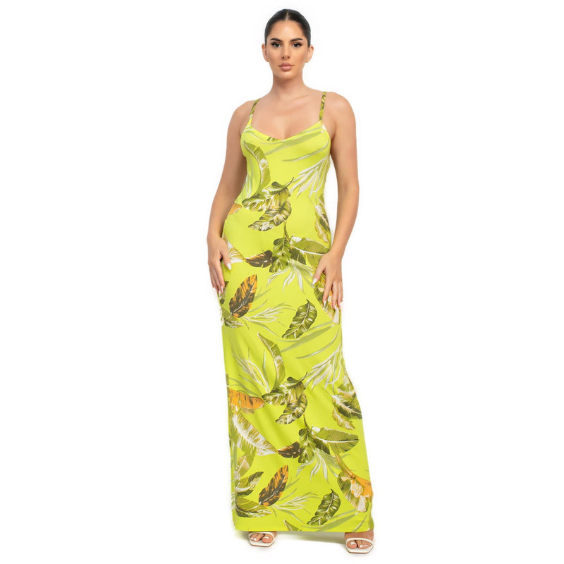 Load image into Gallery viewer, Model displays a lime green tropical print maxi dress, combining comfort with a lively pattern for a standout summer outfit.
