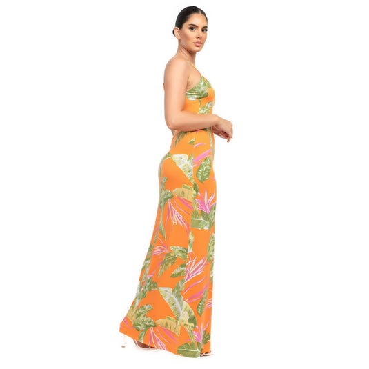 Side view of a figure-hugging orange tropical print maxi dress, highlighting the elegant length and summer pattern.