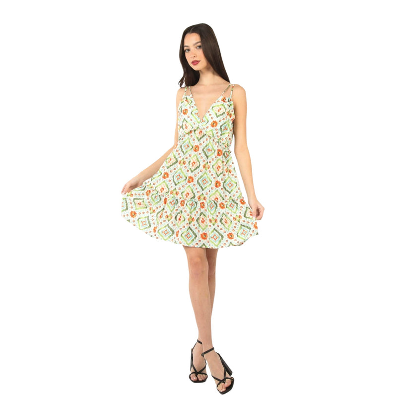 Load image into Gallery viewer, Full front view of a woman in a Tunnel Detail Multi Color Printed Mini Dress with a deep V-neckline and adjustable spaghetti straps. The dress features a vibrant, playful pattern and ruffled hem, ideal for summer outings.
