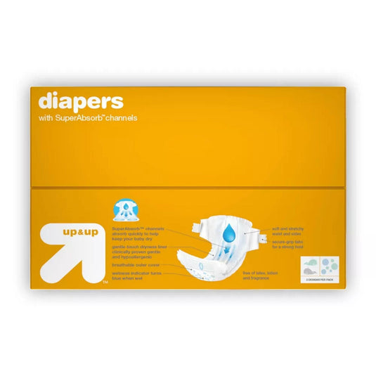 Top view of Up & Up newborn diaper package, featuring key benefits such as SuperAbsorb channels, gentle-touch dryness liner, and secure-grip tabs on a bright yellow background.
