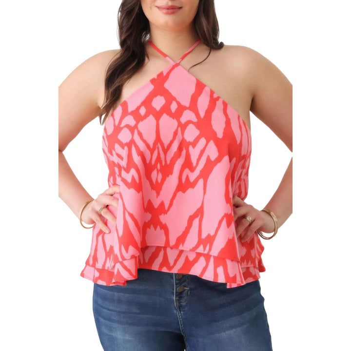 Fashionable red and pink printed halter top with a ruffle hem, highlighting a summer-ready style.