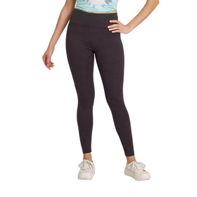  Front view of a woman wearing classic high-waisted charcoal gray leggings, paired with a soft-hued tie-dye cropped t-shirt and white lace-up sneakers.