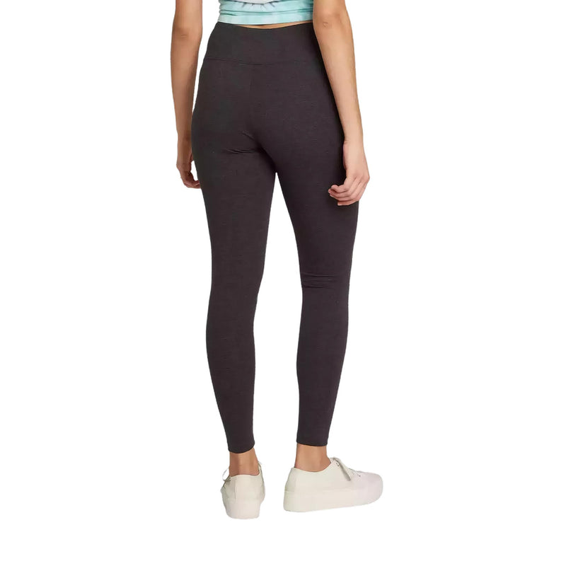 Load image into Gallery viewer, Rear perspective of a woman in snug-fitting charcoal gray high-waisted leggings, showcasing the fit and style, paired with a tie-dye crop top and white casual sneakers.
