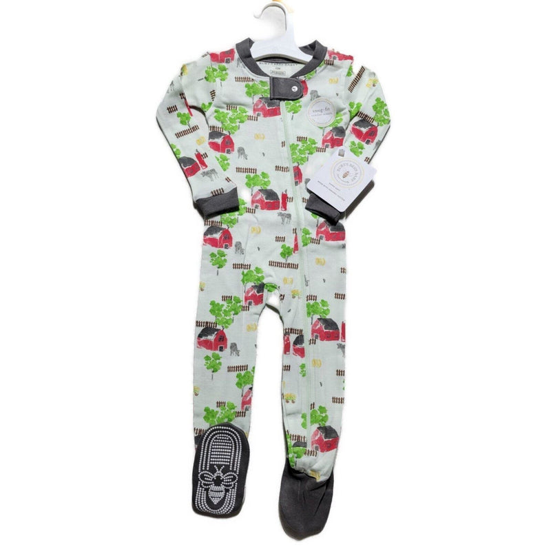 Load image into Gallery viewer, Boys&#39; snug fit pajama with farm-themed print, showcasing the full length with footies and a snap tab zipper cover, hanging against a clean backdrop.
