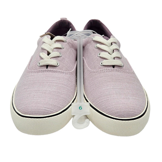 Front view of women's light lavender vulcanized canvas sneakers showcasing classic lace-up design and sturdy build.