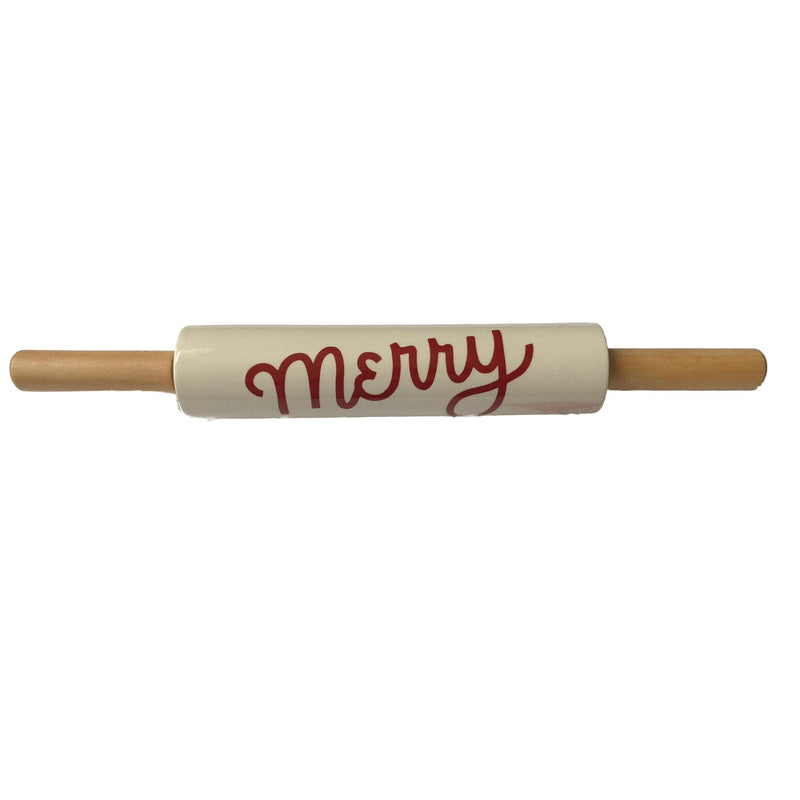 Load image into Gallery viewer, A festive stoneware rolling pin with natural wood handles and &#39;Merry&#39; scripted in cheerful red lettering on the off-white barrel, ready for holiday baking.
